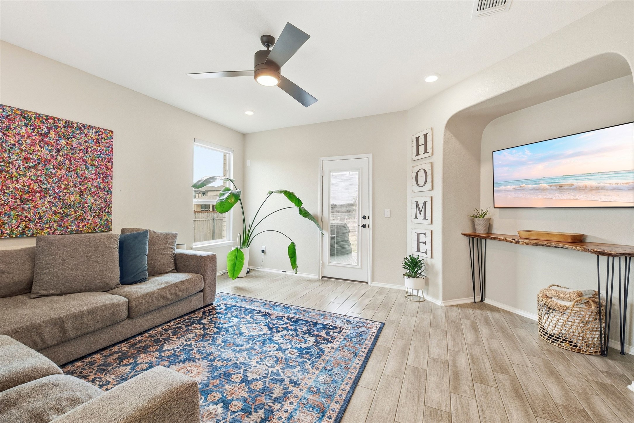 1506 Dragonfly Loop Bastrop, TX 78602 - Photo 10 of 28 Living room featuring wood tiled floors, ceiling fan, and recessed lighting