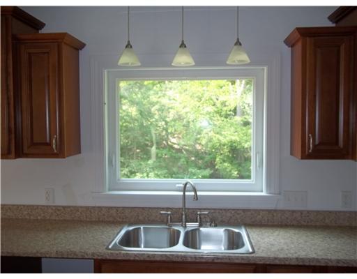Kitchen. New windows throughout the home.  The kitchen window has a great view of the private backyard.