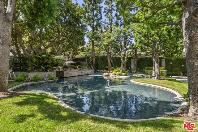 a view of a swimming pool with a sitting area