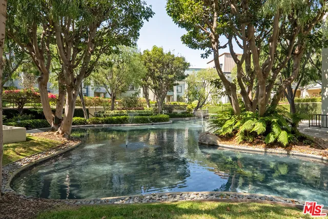 a view of swimming pool with a yard