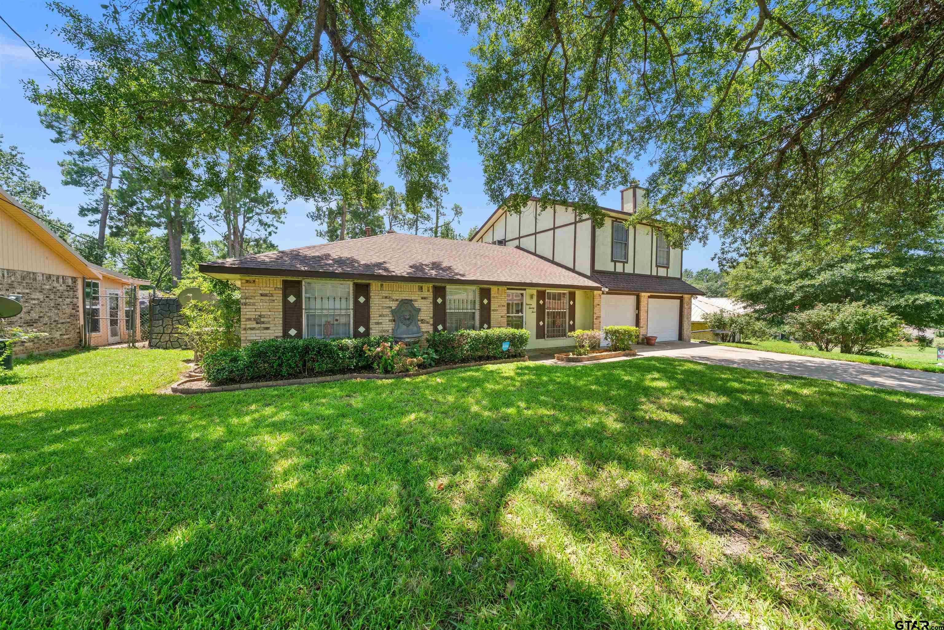 1624 Northridge Drive Tyler, TX 75702 - Photo 1 of 32 a front view of a house with a yard