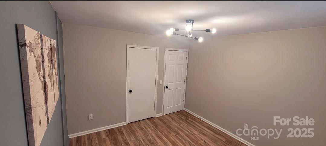 2696 Tablerock Road Lenoir, NC 28645 - Photo 14 of 36 a view of a hallway with wooden floor