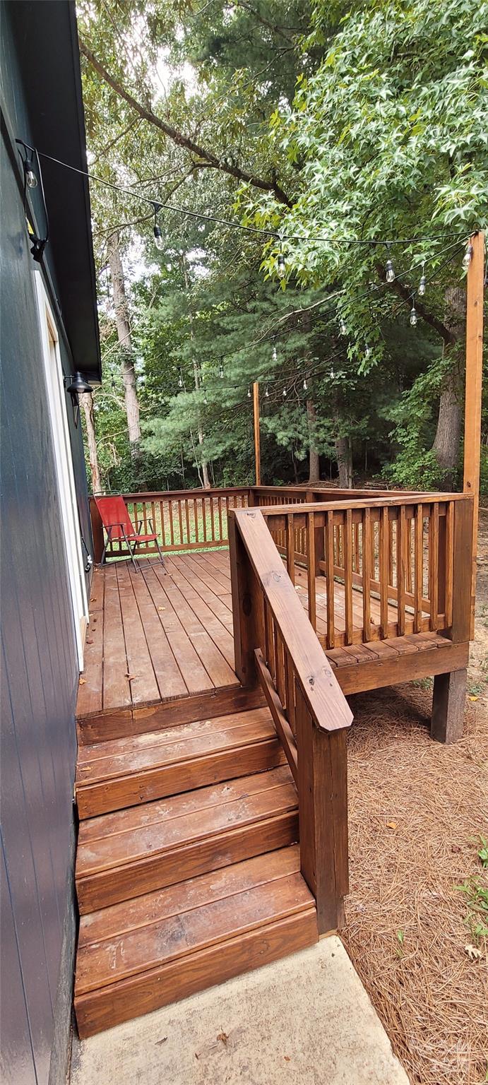 2696 Tablerock Road Lenoir, NC 28645 - Photo 19 of 36 a view of balcony with wooden floor and outdoor seating