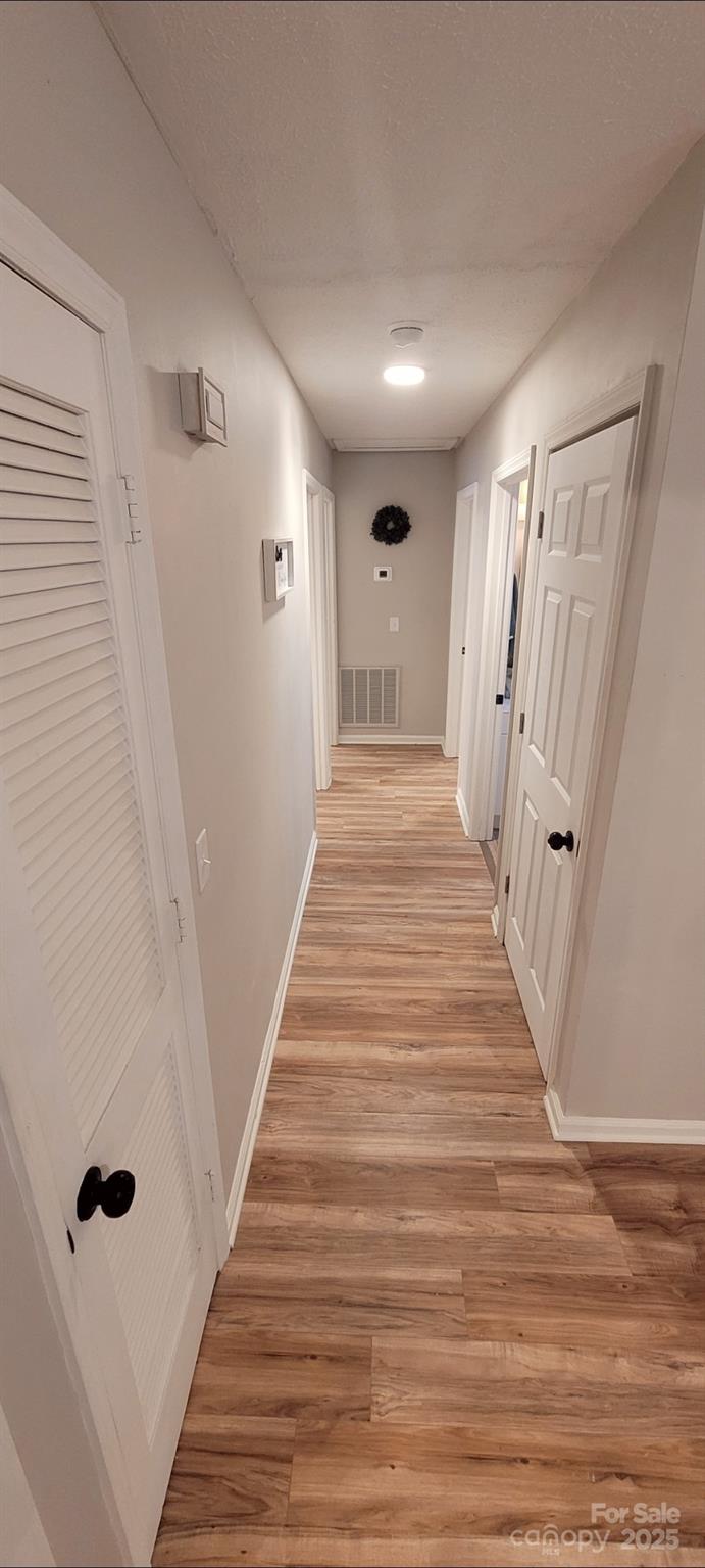 2696 Tablerock Road Lenoir, NC 28645 - Photo 2 of 36 a view of a hallway with wooden floor and staircase