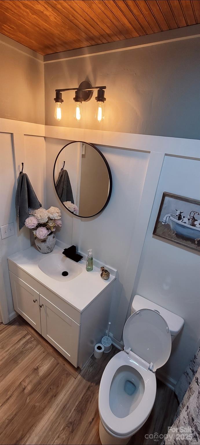 2696 Tablerock Road Lenoir, NC 28645 - Photo 4 of 36 a bathroom with a toilet sink and mirror