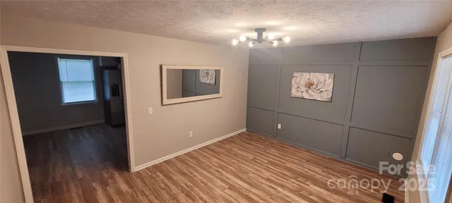 a view of a livingroom with wooden floor