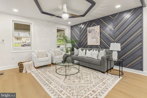 a living room with furniture and a rug