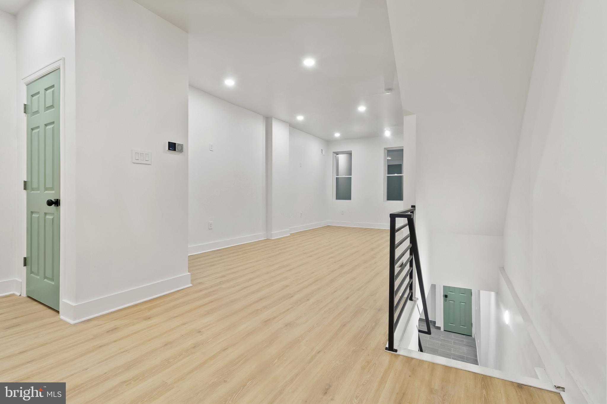 5214 Jefferson Street Philadelphia, PA 19131 - Photo 13 of 28 a view of a hallway with wooden floor