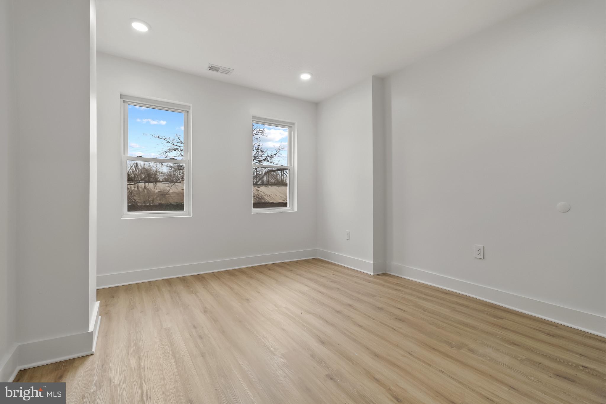 5214 Jefferson Street Philadelphia, PA 19131 - Photo 20 of 28 an empty room with wooden floor and windows