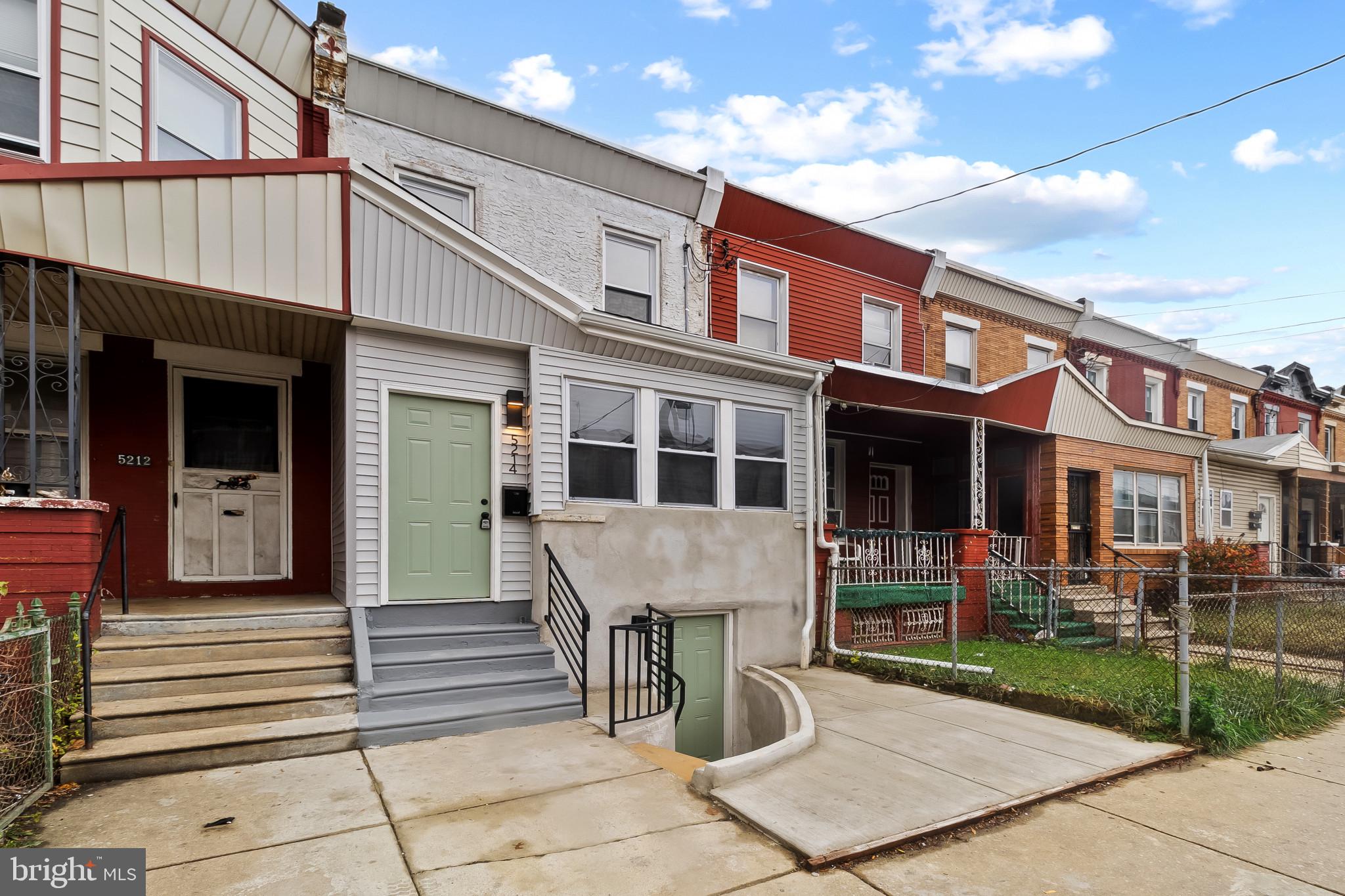 5214 Jefferson Street Philadelphia, PA 19131 - Photo 2 of 28 a front view of a building with garden