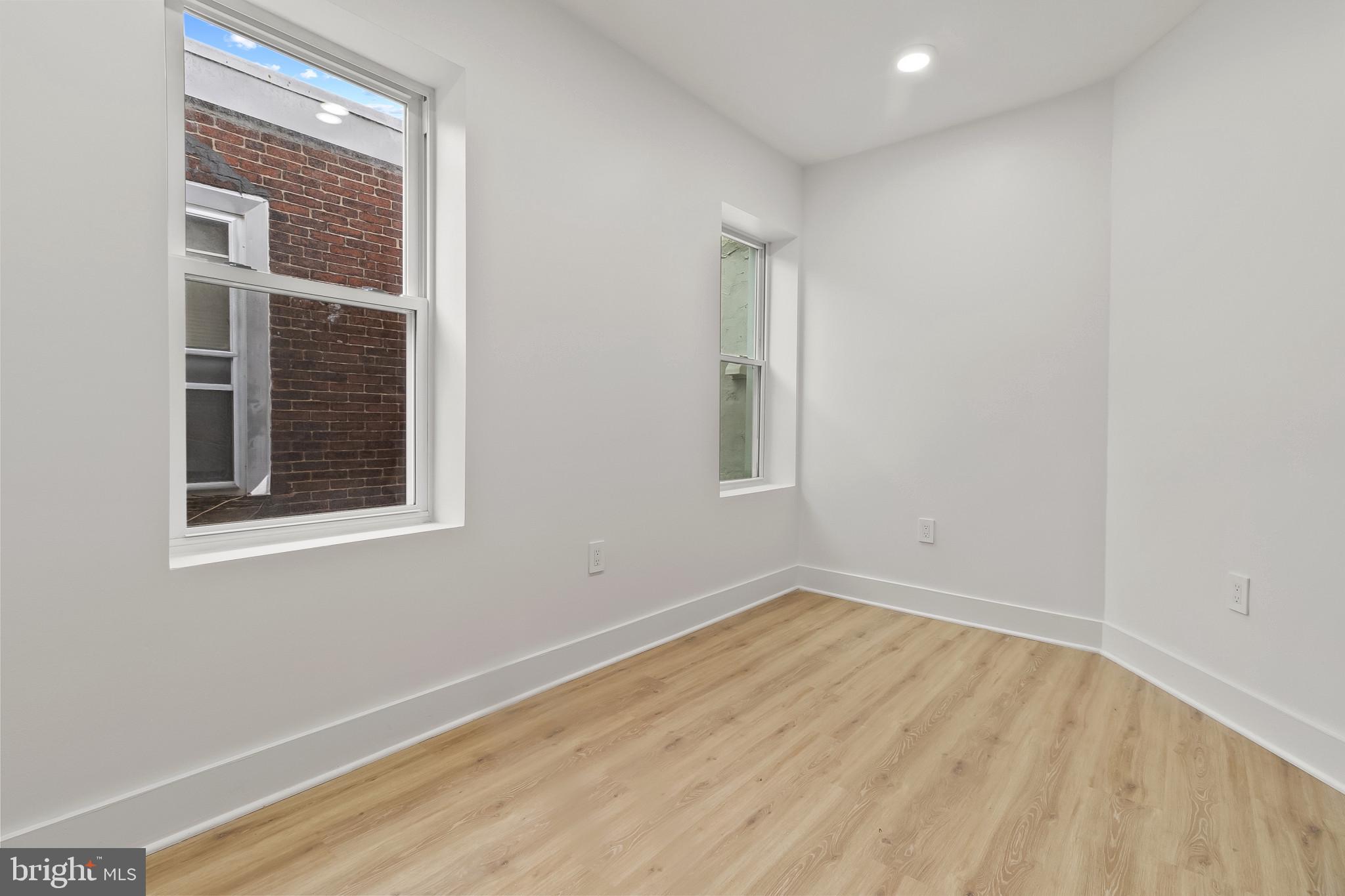 5214 Jefferson Street Philadelphia, PA 19131 - Photo 22 of 28 a view of an empty room with wooden floor and a window