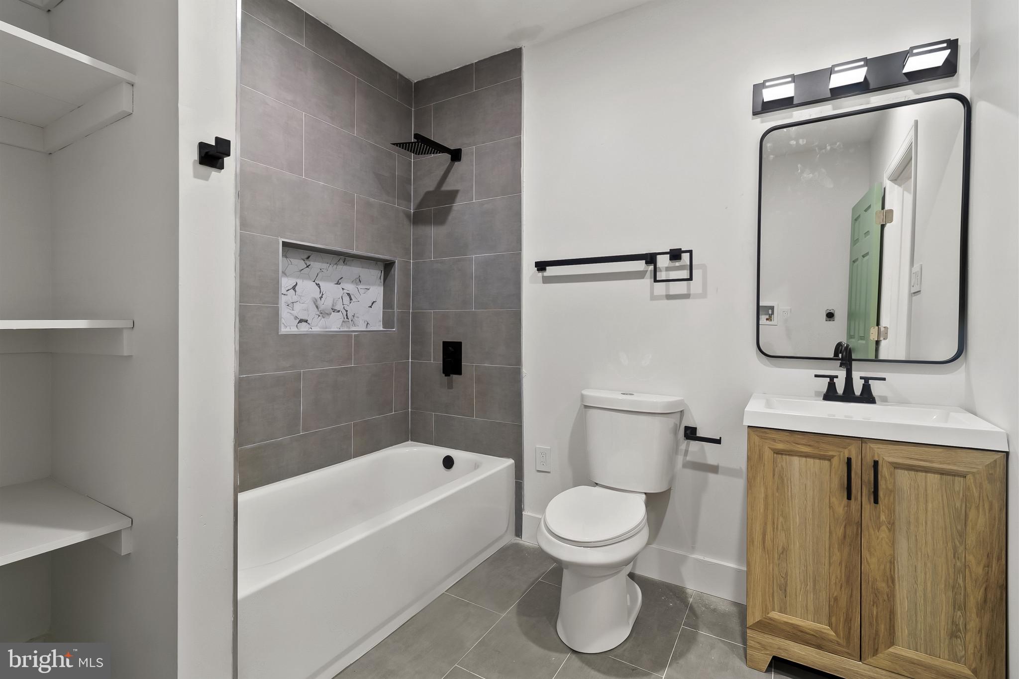 5214 Jefferson Street Philadelphia, PA 19131 - Photo 23 of 28 a bathroom with a toilet a sink and bathtub