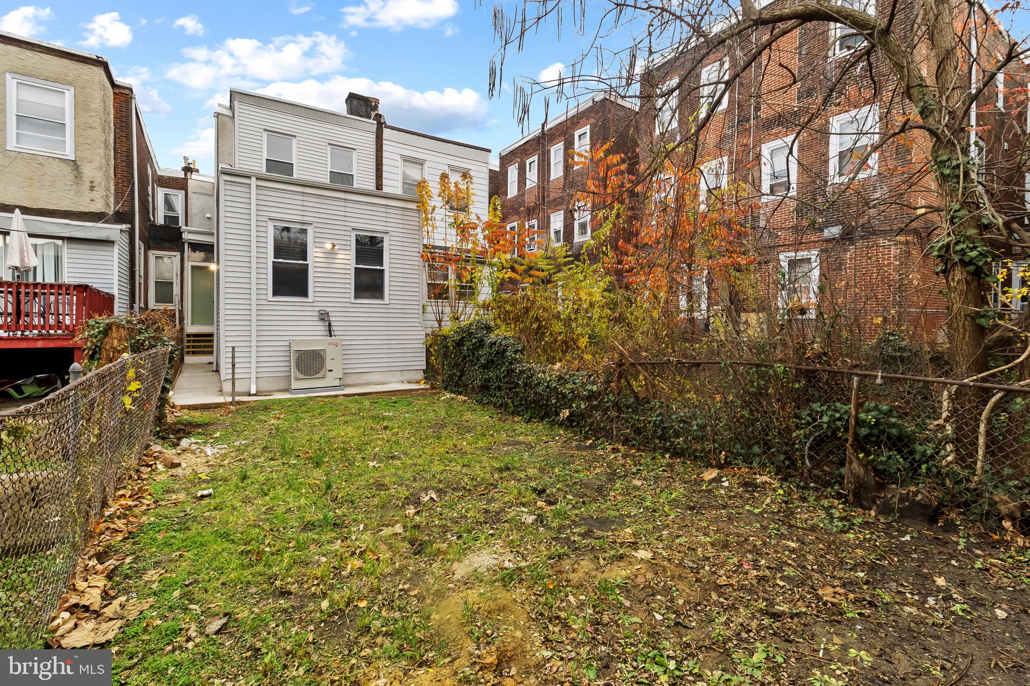 5214 Jefferson Street Philadelphia, PA 19131 - Photo 28 of 28 a view of a blue house with many windows