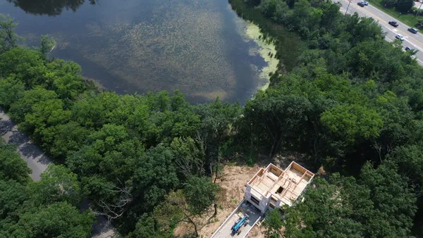 an aerial view of a house with yard and outdoor space