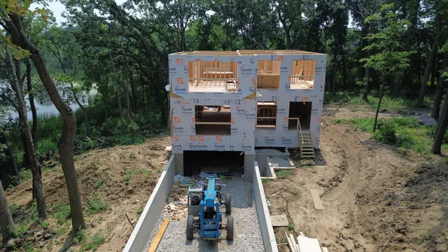 a view of an house with backyard space and balcony