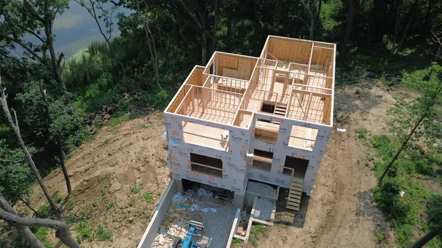 aerial view of a house with a yard