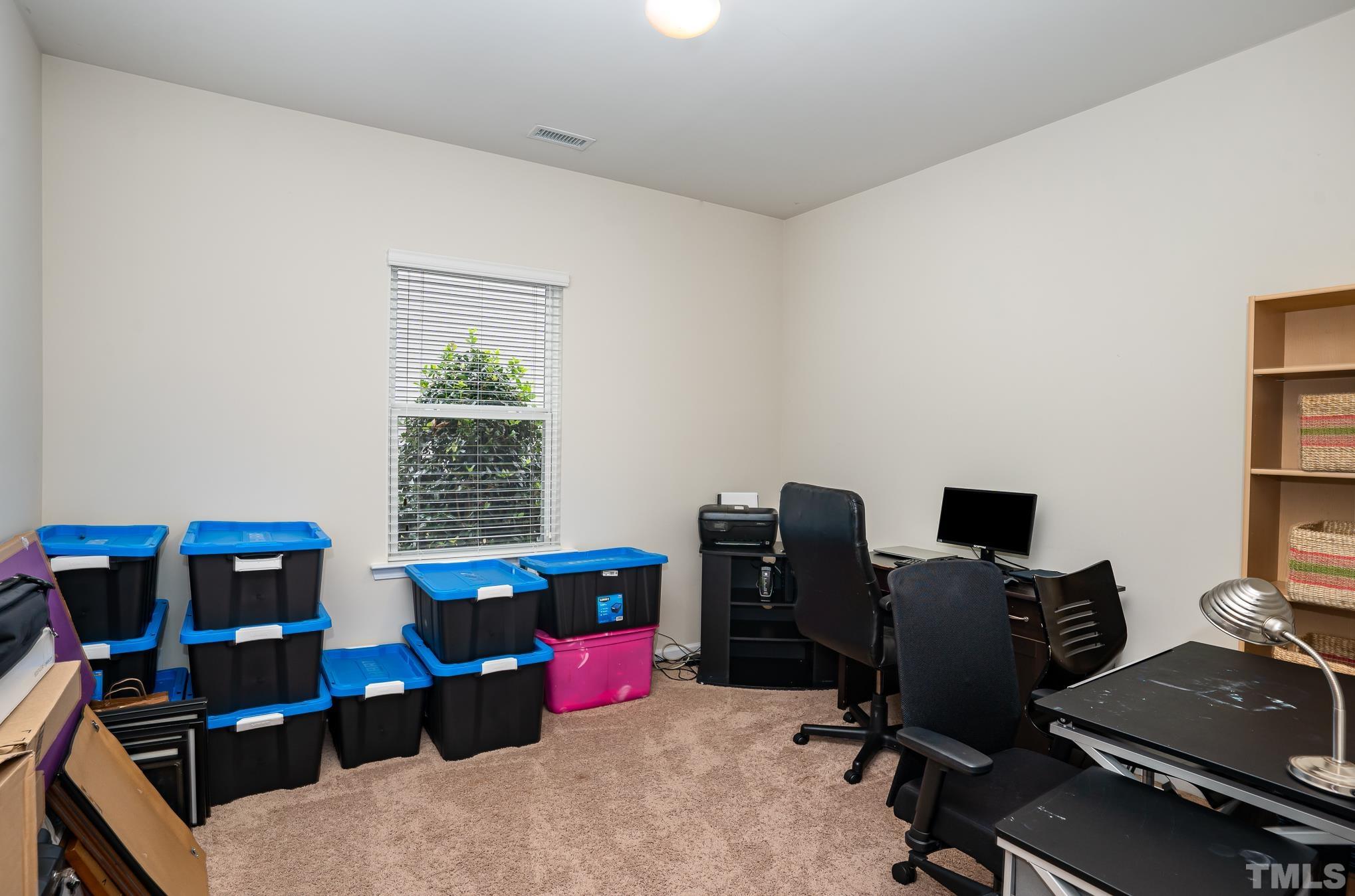 3608 Althorp Drive Raleigh, NC 27616 - Photo 11 of 25 a view of a workspace with furniture and a window