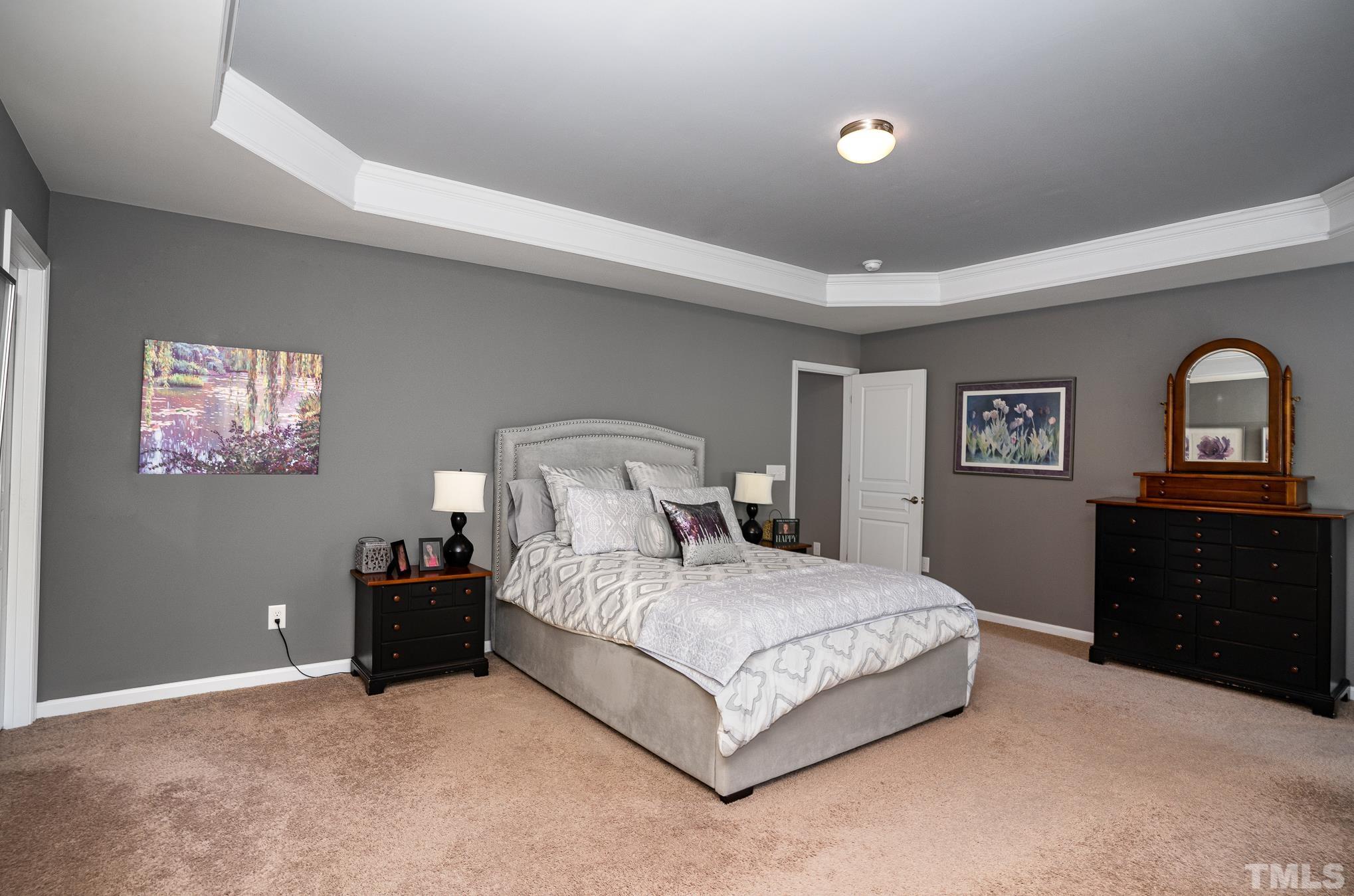 3608 Althorp Drive Raleigh, NC 27616 - Photo 13 of 25 a bedroom with a bed and a dresser