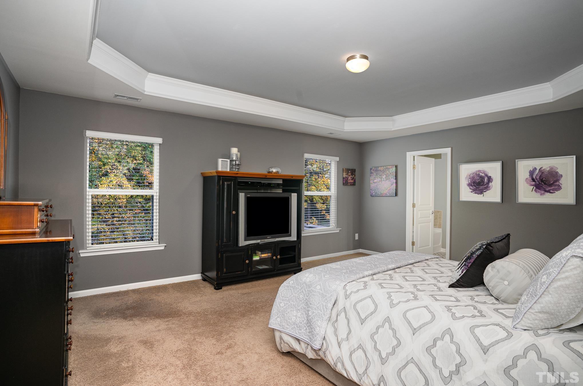 3608 Althorp Drive Raleigh, NC 27616 - Photo 14 of 25 a bedroom with a bed and a television