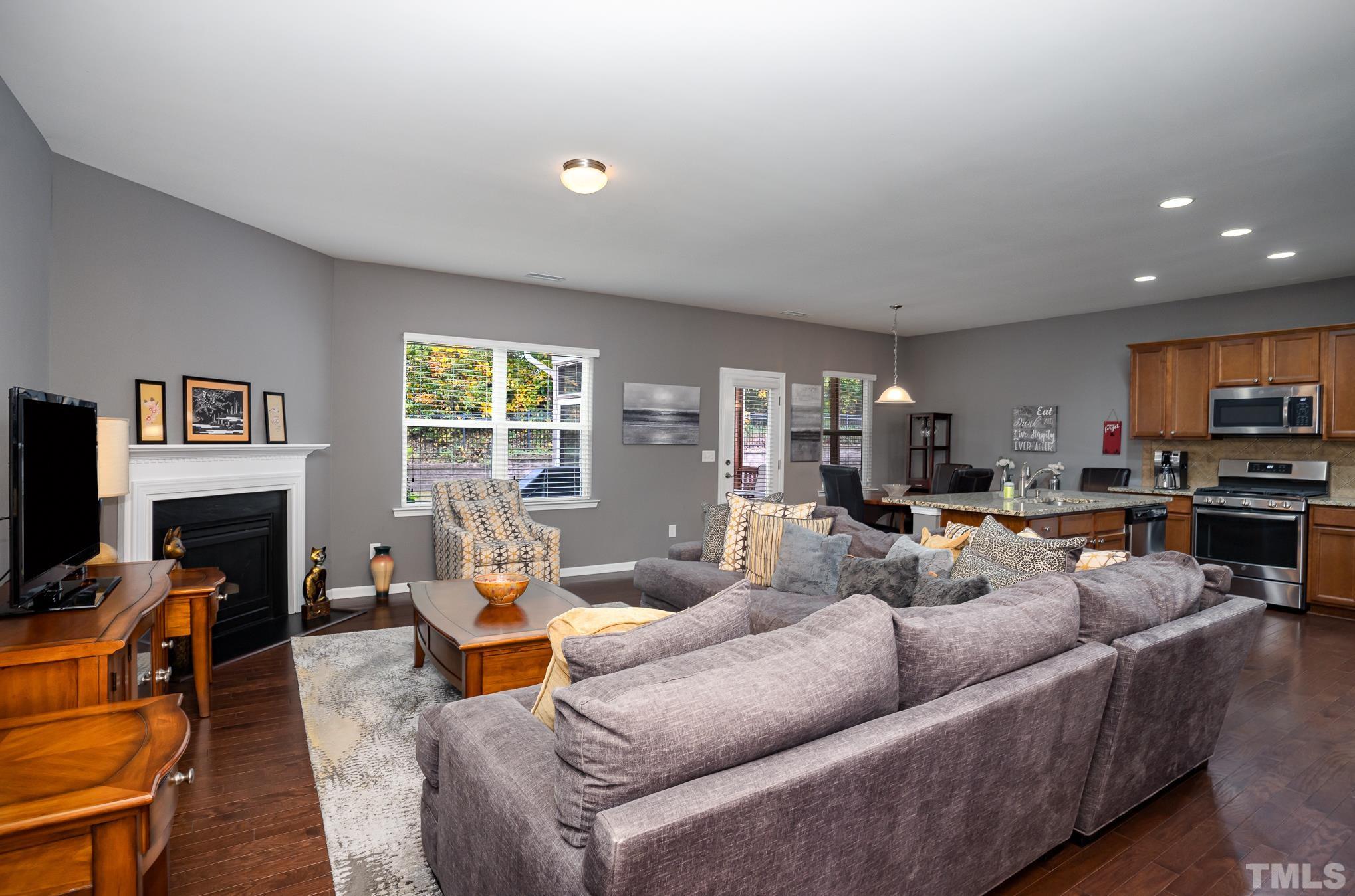 3608 Althorp Drive Raleigh, NC 27616 - Photo 5 of 25 a living room with fireplace furniture and a flat screen tv