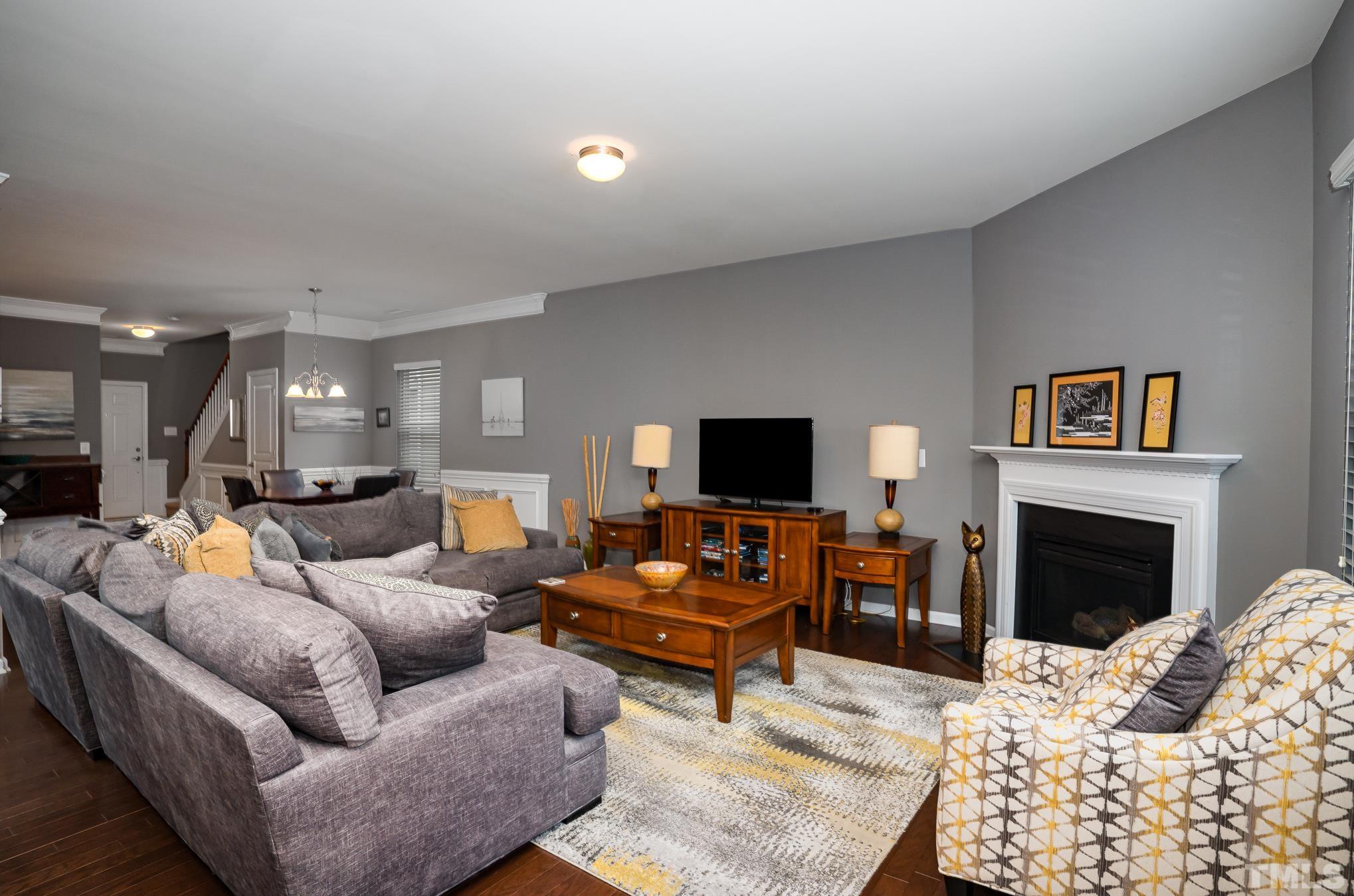 3608 Althorp Drive Raleigh, NC 27616 - Photo 6 of 25 a living room with furniture or couch and a fireplace