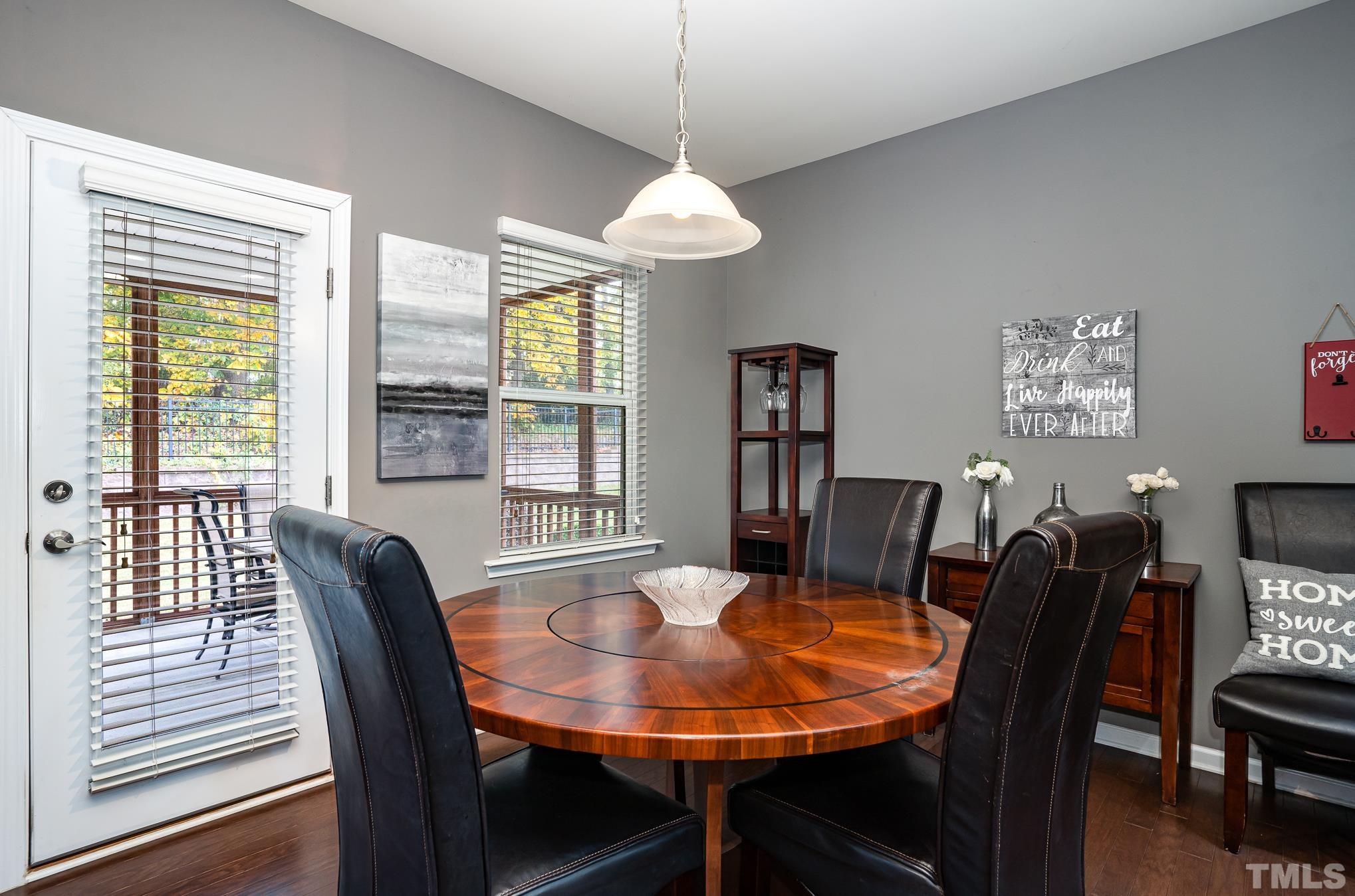 3608 Althorp Drive Raleigh, NC 27616 - Photo 10 of 25 a view of a dining room with furniture window and wooden floor