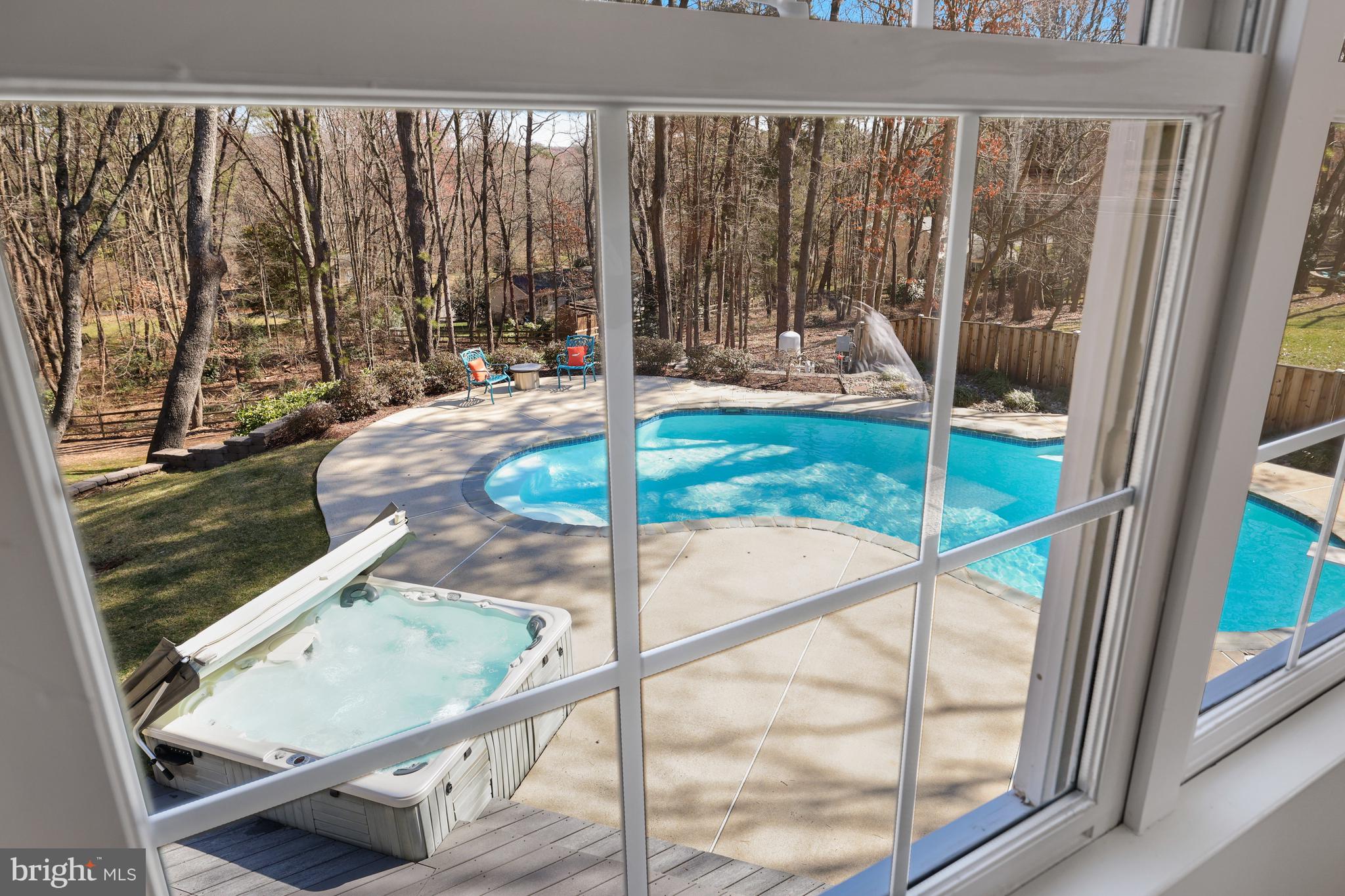 1807 Post Oak Trail Reston, VA 20191 - Photo 46 of 79 a view of a living room and floor to ceiling window