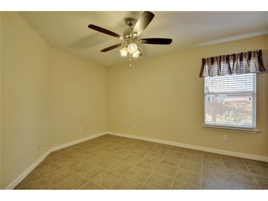 2109 Granite Springs Road Leander, TX 78641 - Photo 16 of 30 A versatile space features tiled flooring and a ceiling fan, ready for your personalized touch.