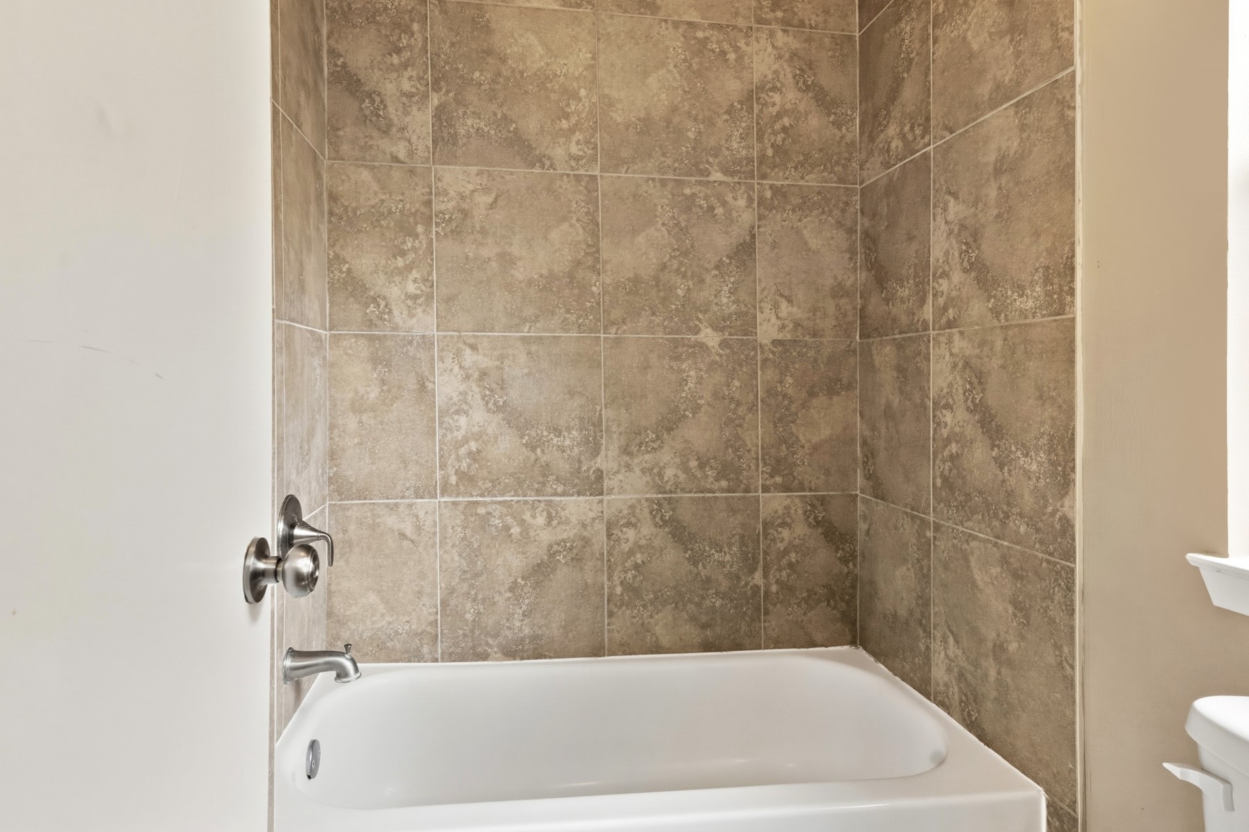 2531 North Spring Drive Spring, TX 77373 - Photo 18 of 24 a bath tub sitting next to a white toilet