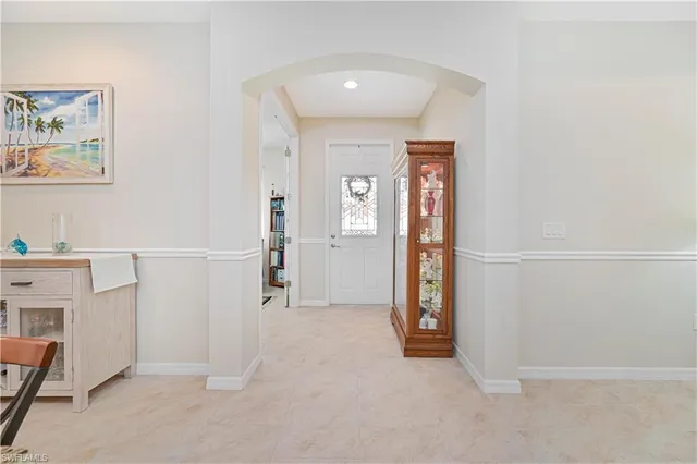 a dining room with furniture and a view of kitchen