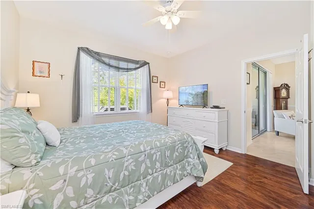 a bedroom with a bed and cabinet