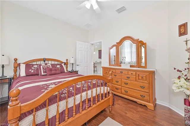 a living room with furniture potted plant and a book shelf