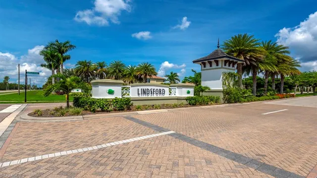 an aerial view of a house with swimming pool and outdoor space