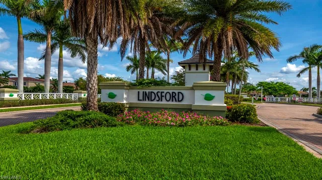 a aerial view of a house with swimming pool garden and patio