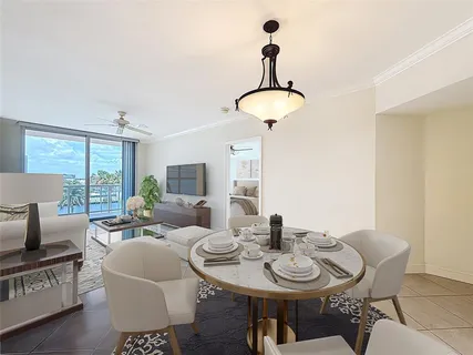 a view of a dining room with furniture window and outside view