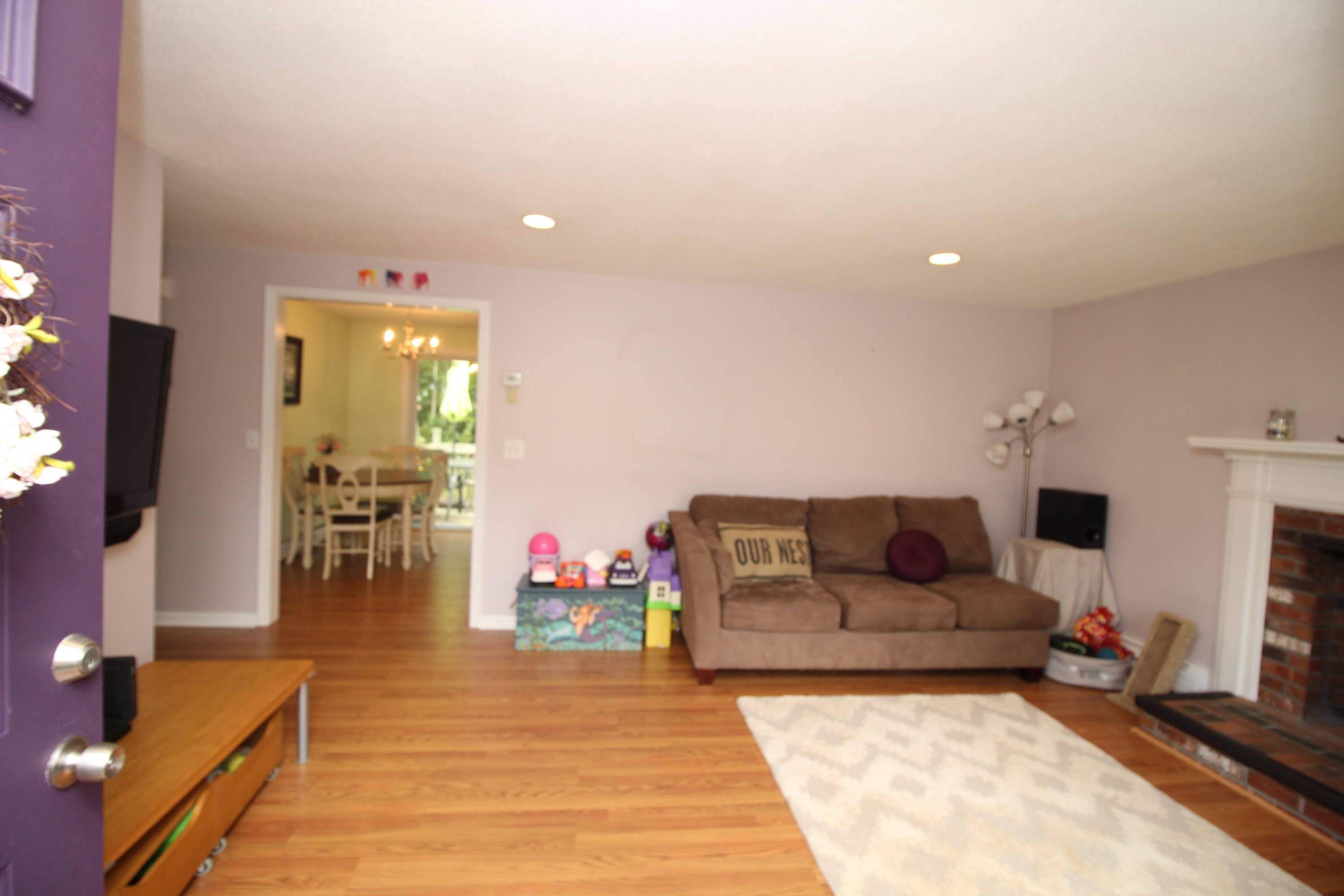 568 Skunknet Road Centerville, MA 02632 - Photo 5 of 18 a living room with furniture and a flat screen tv