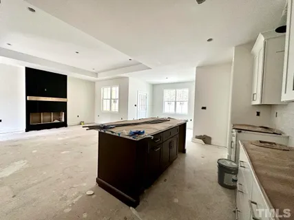 a kitchen with stainless steel appliances granite countertop a stove and a refrigerator
