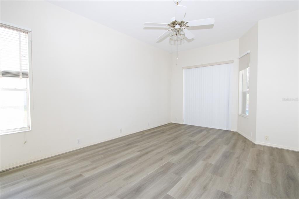 2319 Sunview Avenue Valrico, FL 33596 - Photo 12 of 41 an empty room with a window and a fan