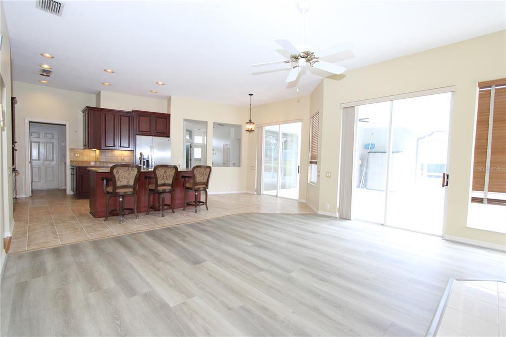 2319 Sunview Avenue Valrico, FL 33596 - Photo 25 of 41 a living room with furniture and a chandelier
