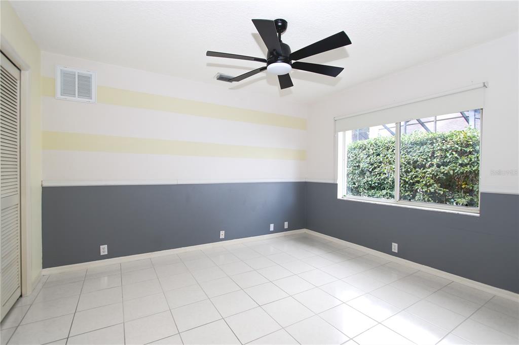 2319 Sunview Avenue Valrico, FL 33596 - Photo 27 of 41 a view of room with window and ceiling fan