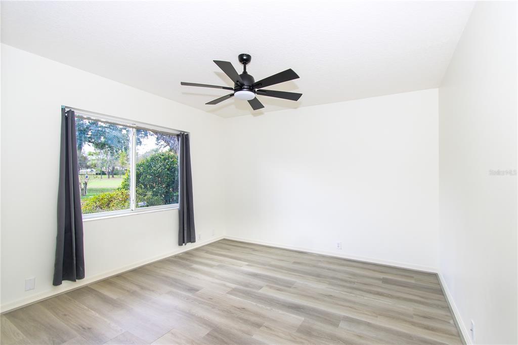 2319 Sunview Avenue Valrico, FL 33596 - Photo 33 of 41 a view of a big room with wooden floor and a ceiling fan