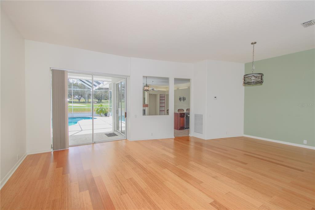 2319 Sunview Avenue Valrico, FL 33596 - Photo 9 of 41 a view of an empty room with wooden floor and a window