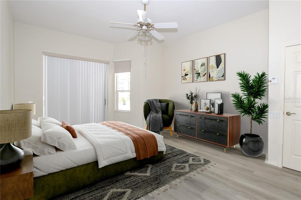 2319 Sunview Avenue Valrico, FL 33596 - Photo 10 of 41 a bedroom with a bed and a potted plant