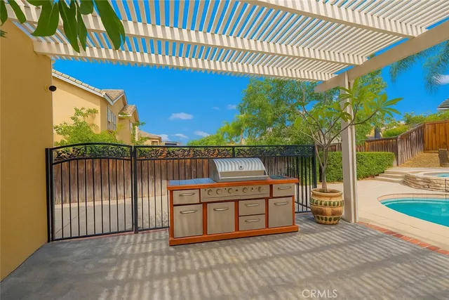 a view of a deck with wooden floor and fence