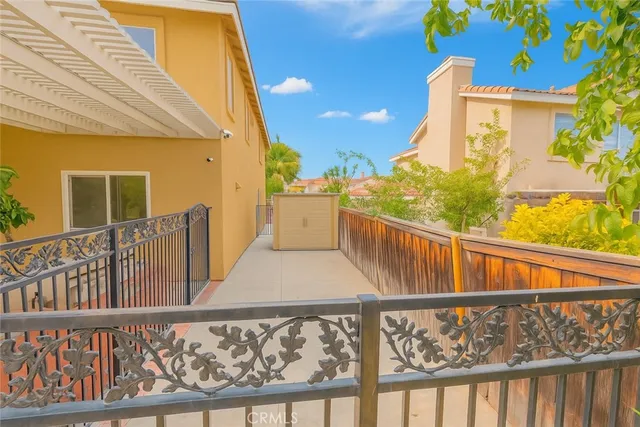 a view of balcony with wooden floor