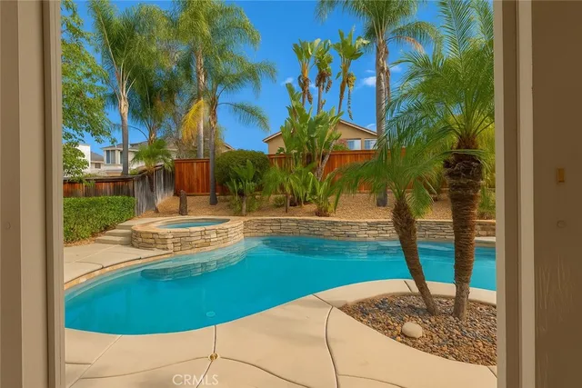 a view of a swimming pool with a yard