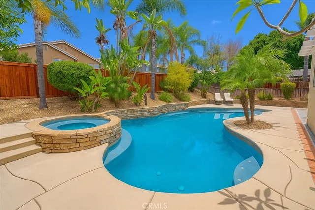 a view of a swimming pool with an outdoor space