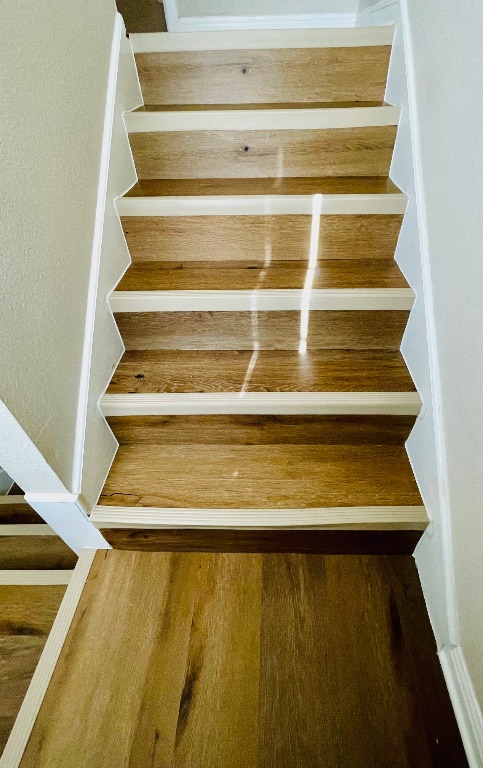 600 Kawnee Drive, Unit D Austin, TX 78752 - Photo 12 of 12 Staircase with wood finished floors