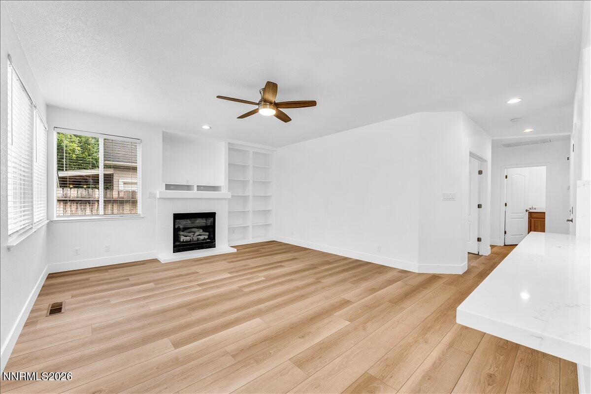 2329 Red Maple Court Reno, NV 89523 - Photo 15 of 39 a view of an empty room with window and fireplace