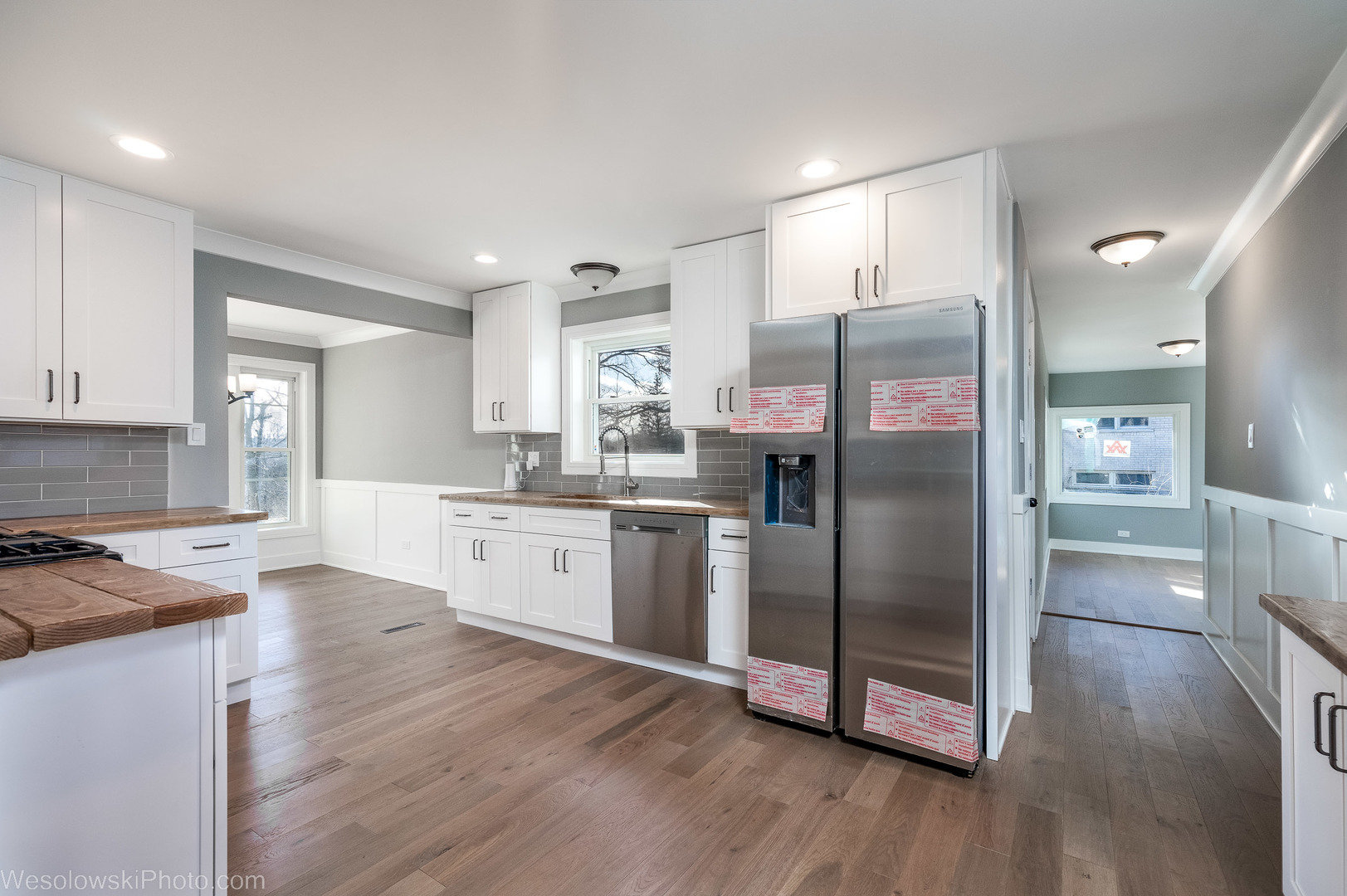 820 Exmoor Road Olympia Fields, IL 60461 - Photo 11 of 35 a kitchen with stainless steel appliances granite countertop a refrigerator a sink a stove and white cabinets with wooden floor